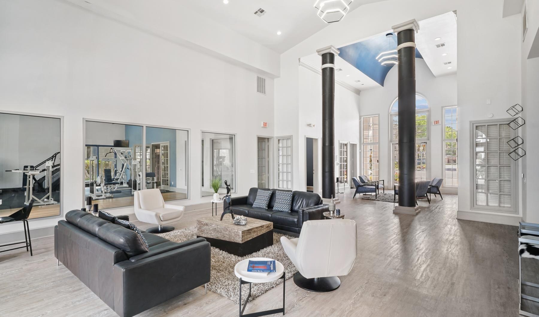 Take advantage of all Paramount at Kingwood has to offer a lobby with couches and large beams